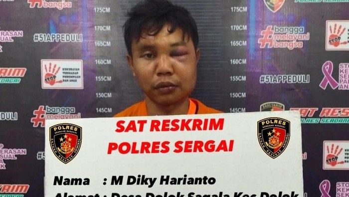 Suspek Diki Haryanto ketika ditahan oleh pihak polis