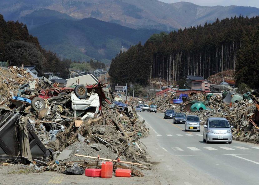 Vehicles move around Rikuzentakata, Iwate prefecture on March 29, 2011.Japan was hit on March 11 by a massive quake and tsunami that shattered towns along the coast of the northeastern Tohoku region, has left more than 28,000 dead or missing, and sparked a major nuclear plant emergency.AFP PHOTO / TOSHIFUMI KITAMURA