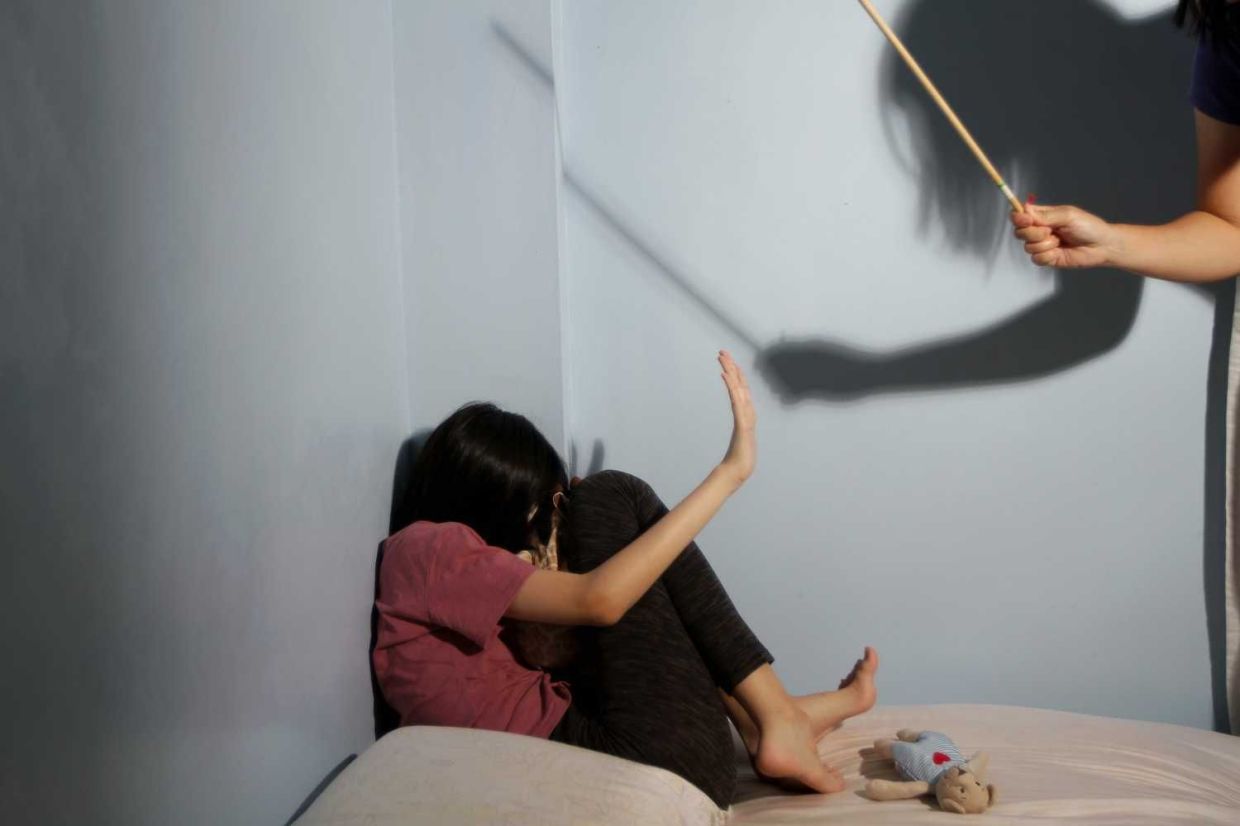 Posed picture of child abuse for news. — YAP CHEE HONG/The Star