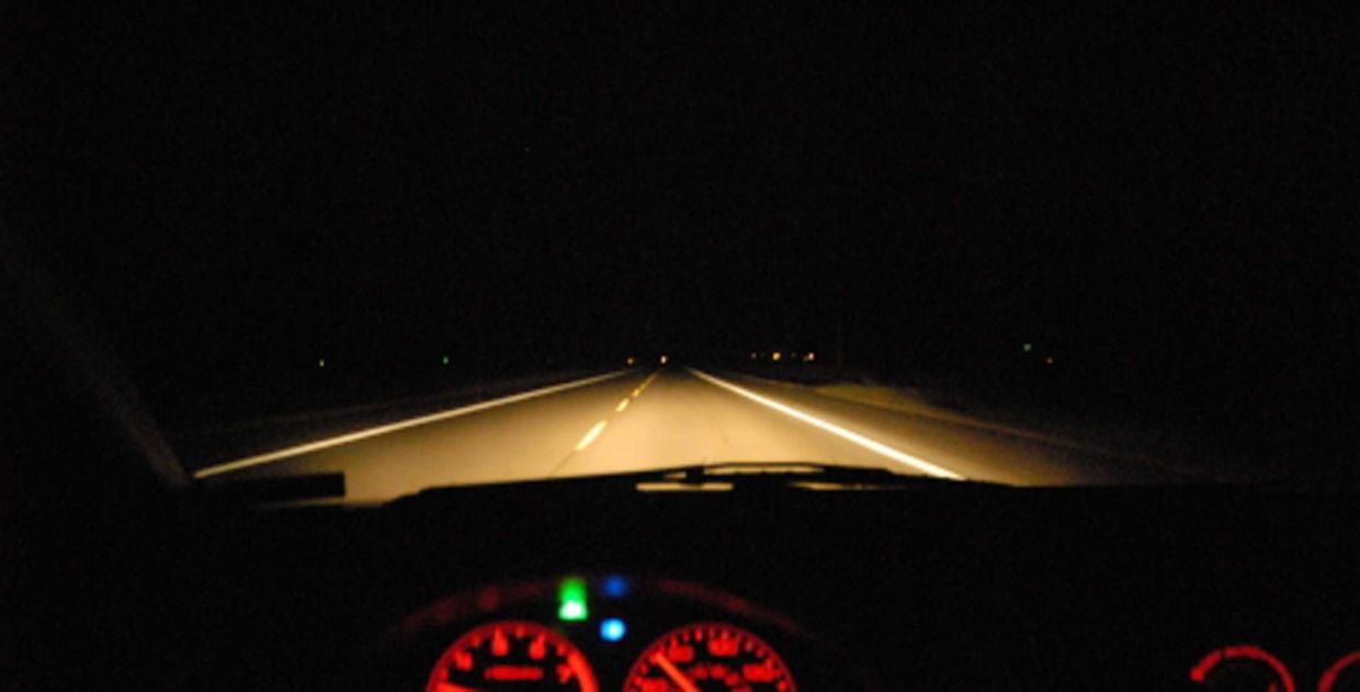 Lekas highway during the night. Only the car headlights is a guiding source.