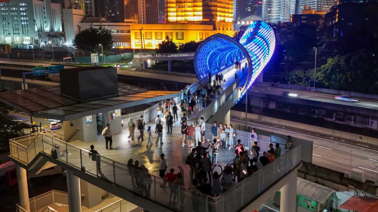 An aerial view of peoples enjoying the view at Saloma Link in Kuala Lumpur at night. — IZZRAFIQ ALIAS/The Star