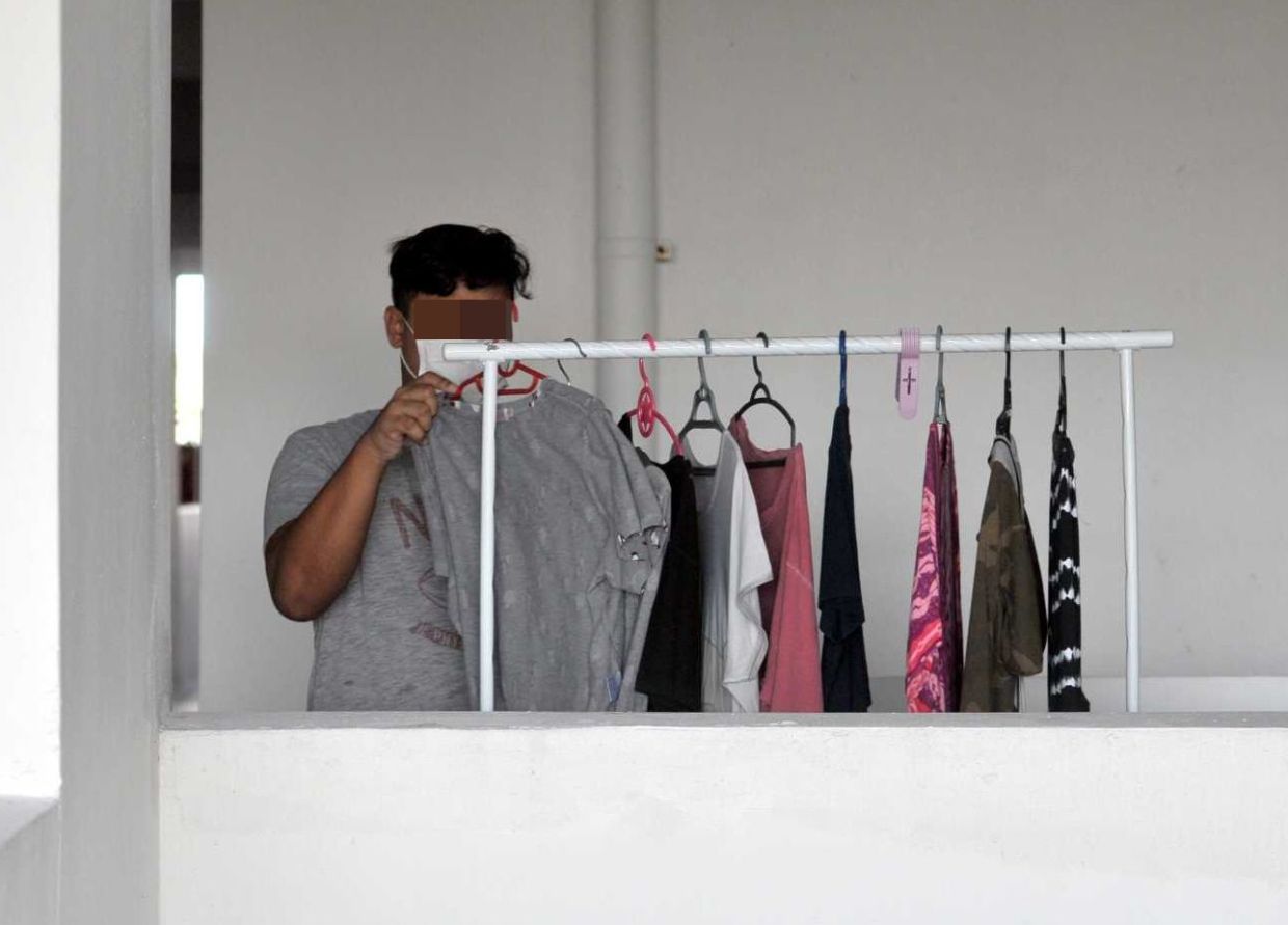 As the temporary closure of all Courts in Malaysia forced all lawyers to stay at home, a lawyer Muhammad Firdaus Adnan, 31, helping his wife doing laundry during the Movement Control Order (MCO) at home in Taman Molek, Johor Bahru on Tuesday (March 24).