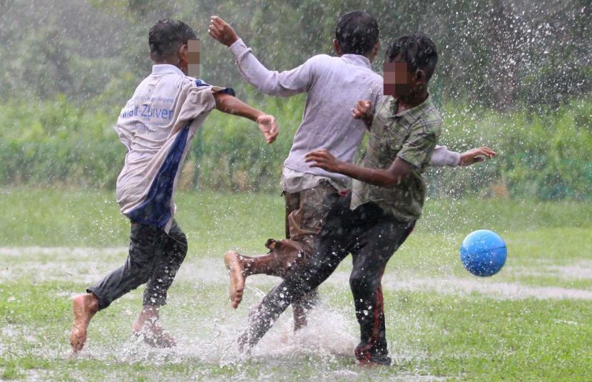 Orang Asli kids having a fun filled time playing football in the rain especially during the year end school holidays. The kids from Kampung Simpang Arang, Gelang Patah play almost daily whether rain or shine.