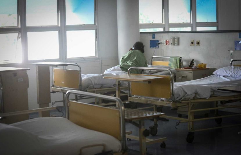 ACovid-19 patient makes a phone call from her bed at a quarantine ward in Kuala Lumpur General Hospital.AZHAR MAHFOF/The Star.