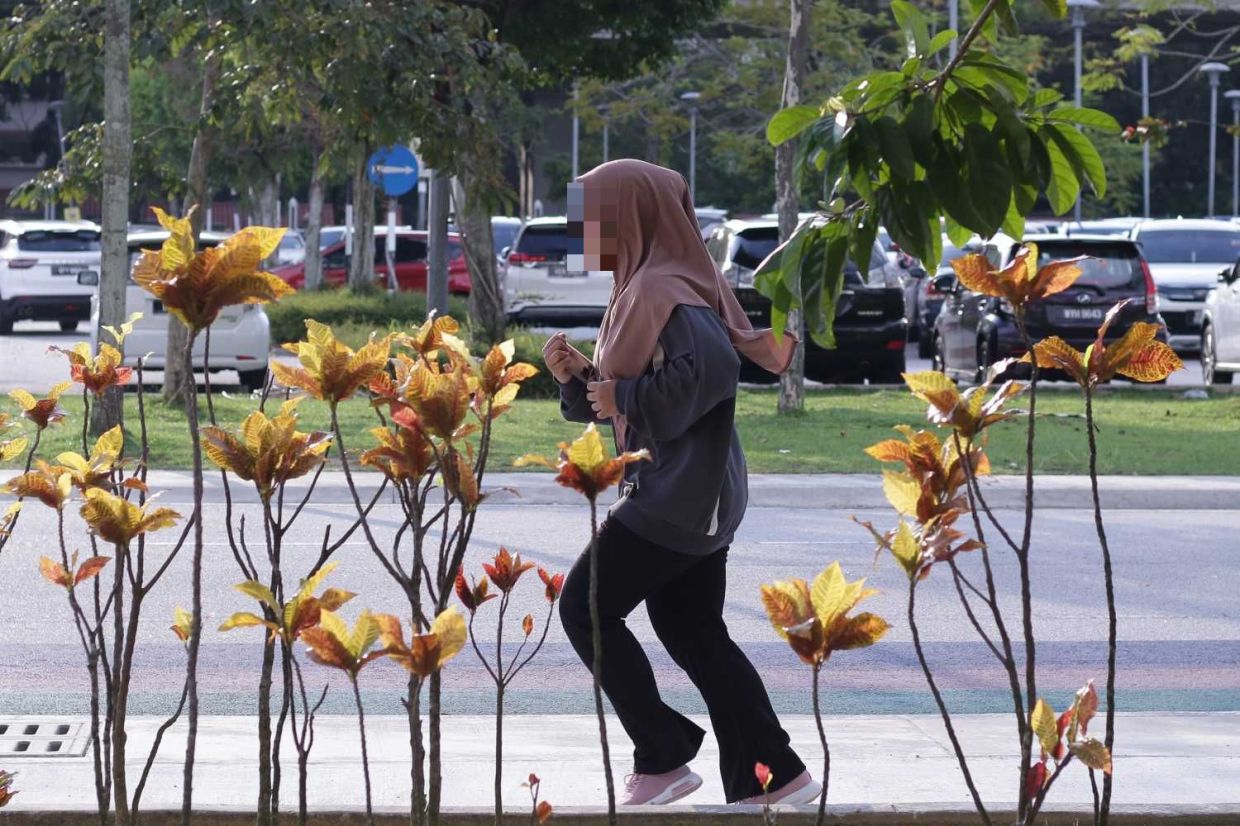 People doing exercise for a healthy life at National Stadium in Bukit Jalil National on weekend. — IZZRAFIQ ALIAS/The Star
