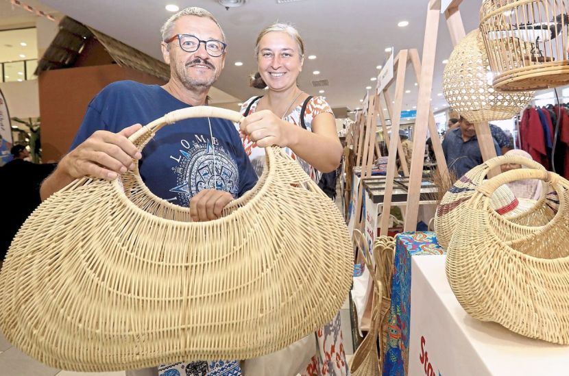 (From left) Michael Mick who originated from Germany and his wife Nataliia Smetanina who originated from Ukraine were drawn in by the carnival's setting as they stepped into Kuantan City Mall.
