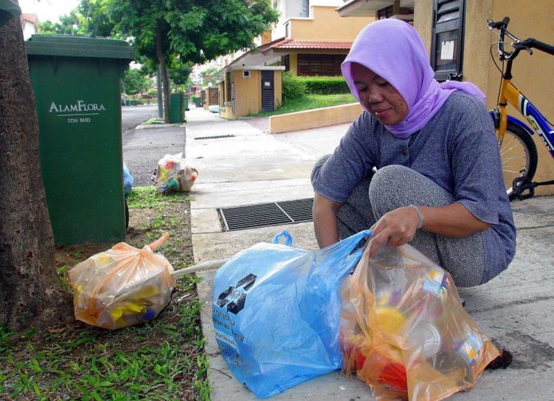 Domestic helper Nalwiyah Karman, 42, finds separating the waste uncomplicated.