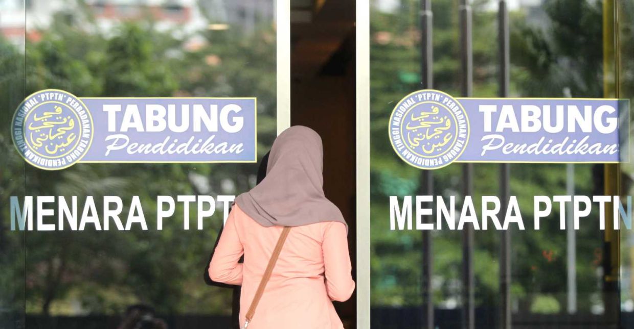 A customer is seen walking into the Menara PTPTN after the press conference by PTPTN chairman Wan Saiful Wan Jan. AZMAN GHANI / The Star