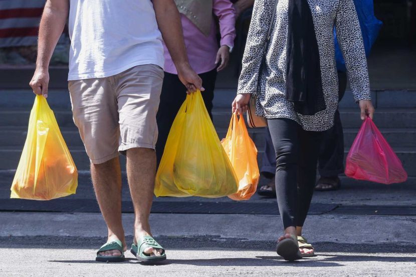 Peoples was seen using the single use plastic bags while buying groceries at Pasar Moden Seksyen 6 in Shah Alam yesterday. — IZZRAFIQ ALIAS/The Star