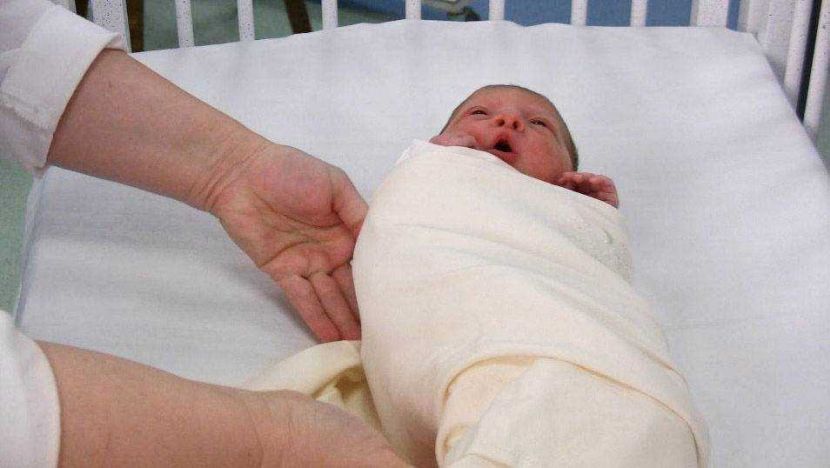 Lisa Vallee, Nurse Educator at the NICU (Neo-Natal Intensive Care Unit) at Presbyterian Hemby Children's Hospital, in Charlotte, N.C., demonstrates how to properly swaddle (wrapping infants snugly in swaddling cloths, blankets or similar cloth so that movement of the limbs is tightly restricted) the infant. (Phillip C. Hoffman/Charlotte Observer/MCT)