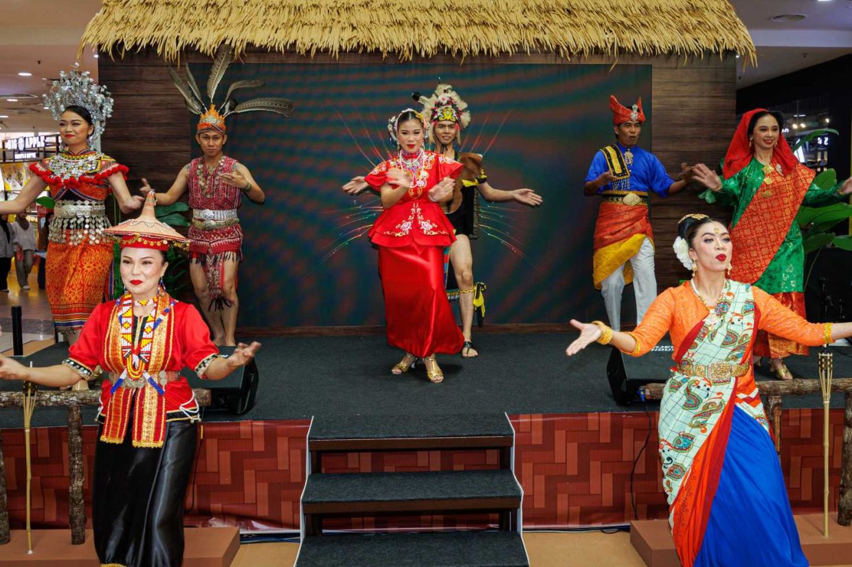 Cultural ambassadors from the Sarawak Department of National Culture and Arts (JKKN) perform a traditional dance during the opening ceremony of the Star Karnival Cuti-Cuti Malaysia at Plaza Merdeka, showcasing the rich cultural heritage of Sarawak to promote domestic tourism and celebrate Malaysia’s diverse traditions. — ZULAZHAR SHEBLEE/The Star