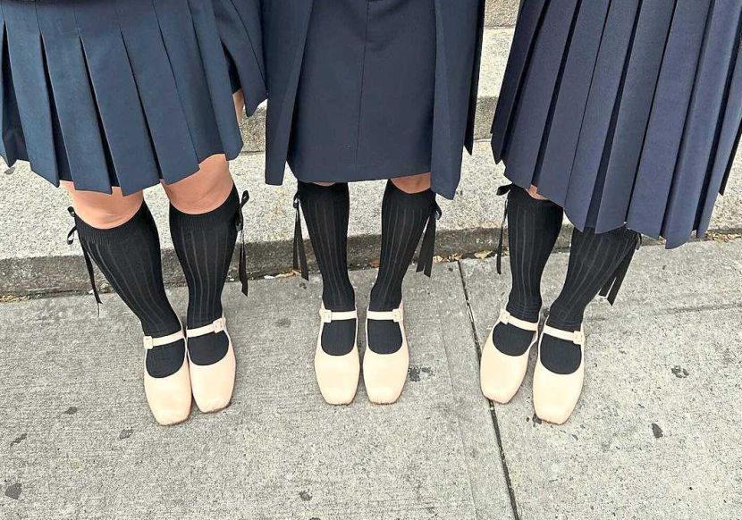 You can pair your everyday uniform with knee length socks with bows and nude ballet shoes. — Sandy Liang/Instagram