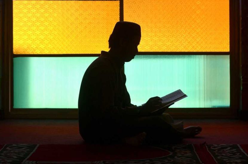 A Muslim man is silhoutted as he sits at a mosque in Subang to recite the holy Quran in the last leg of Ramadan this year. Muslim will step up the good deeds in the remaining of 10 days in Ramadan to search for Lailatul Qadar or Night of Decree, Night of Power, Night of Value, Night of Destiny, or Night of Measures. It is in Islamic belief the night when the first verses of the Quran were revealed to the Islamic prophet Muhammad. It is one of the odd nights of the last ten days of Ramadan and is better than 1000 months of worship. Muslims believe that on this night the blessings and mercy of Allah are abundant, sins are forgiven, supplications are accepted, and that the annual decree is revealed to the angels who also descend to earth. RAJA FAISAL HISHAN/The Star. metro backpage | thousand words