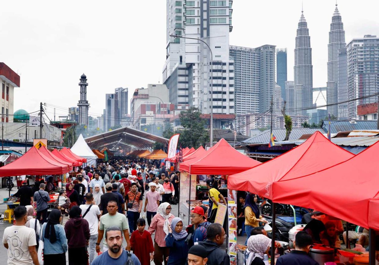 A dense crowd of shoppers moves through rows of food and retail stalls at the Bazar Ramadan Kampong Bharu 2026, Kuala Lumpur. — FAIHAN GHANI/The Star