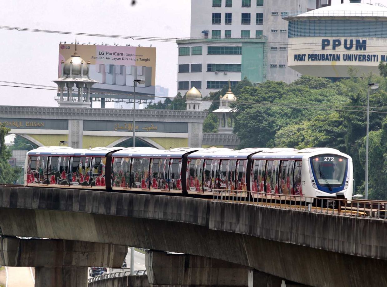 -- Minister of Communications and Digital Fahmi Fadzil saw the 'Cerita Malaysiaku' themed decorations and visuals in conjunction with the 60th Malaysia Day that are present on the entire LRT Train when he attended the launch of the 'Cerita Malaysiaku' Train at the Universiti LRT Station today. The 'Cerita Malaysiaku' trend is specially wrapped and decorated with visuals that display Malaysia as a country with diverse races and cultures. --). KAMARUL ARIFFIN/The Star