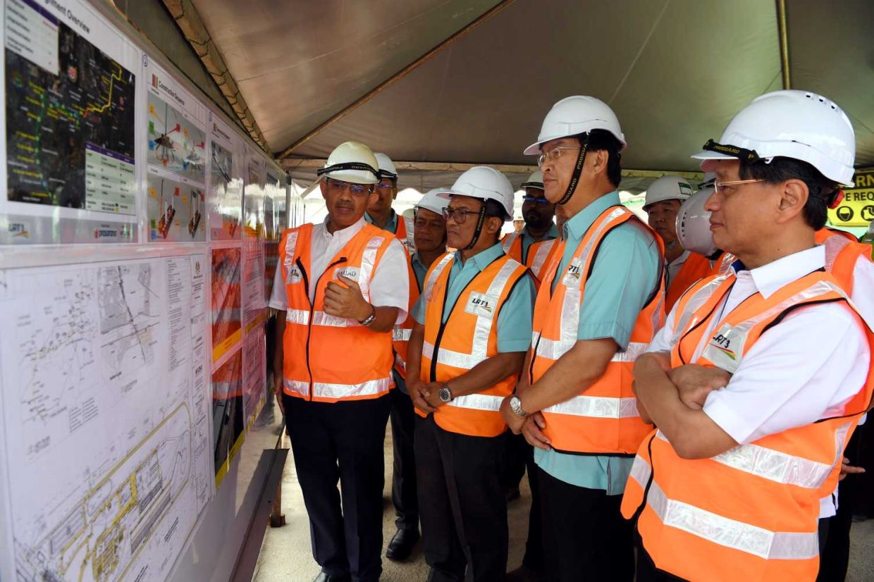 (from 2nd right)Works Minister Baru Bian accompanied byDatuk Ir Elias IsmailDeputy Chief Excutive CIDB Malaysia and MRCB George Kent Sdn Bhd infrastructure director Mohammad Amjad Faruq Mohammad Haniff during theworking visit to the LRT3 construction site Johan Stia in KlangMRCB George Kent Sdn Bhd infrastructure director Mohammad Amjad Faruq Mohammad Haniff